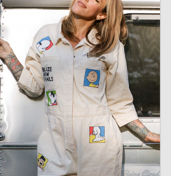 Model wearing an Airstream and Peanuts patch coverall